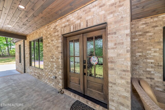 8304 Davis Ferry Rd, Loudon, TN 37774 - view of exterior entry with brick siding and french doors