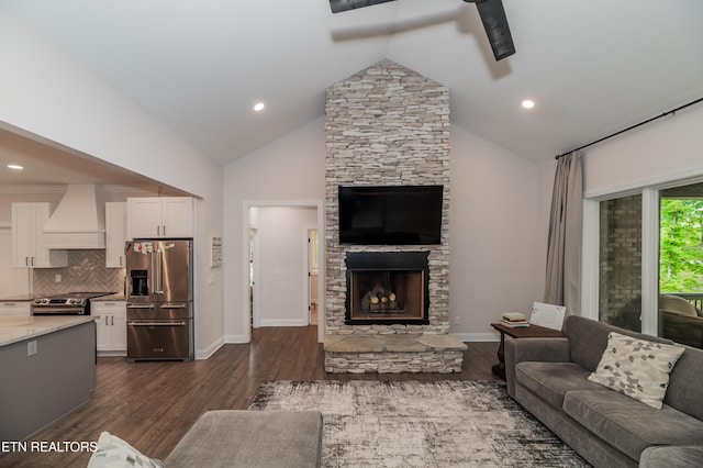 8304 Davis Ferry Rd, Loudon, TN 37774 - living area with recessed lighting, baseboards, a stone fireplace, dark wood finished floors, and high vaulted ceiling