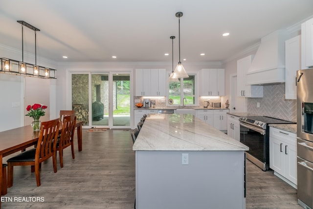8304 Davis Ferry Rd, Loudon, TN 37774 - kitchen featuring crown molding, a center island, appliances with stainless steel finishes, and custom range hood