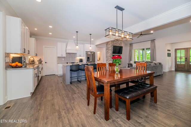 8304 Davis Ferry Rd, Loudon, TN 37774 - dining space with ornamental molding, dark wood-type flooring, visible vents, and recessed lighting