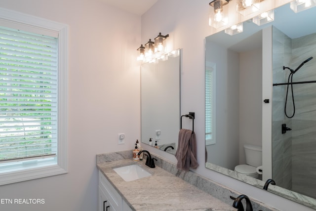8304 Davis Ferry Rd, Loudon, TN 37774 - bathroom featuring toilet, a tile shower, and vanity