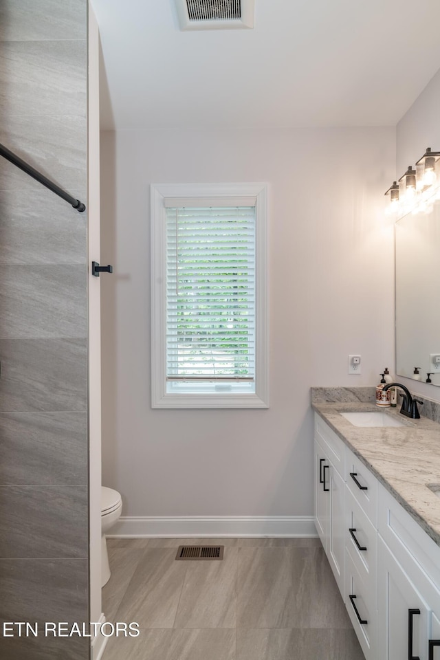 8304 Davis Ferry Rd, Loudon, TN 37774 - bathroom featuring a sink, baseboards, and visible vents