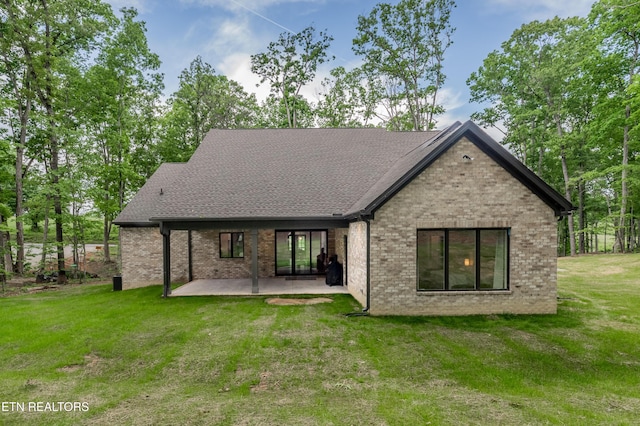 8304 Davis Ferry Rd, Loudon, TN 37774 - back of house with a patio area, brick siding, and a lawn