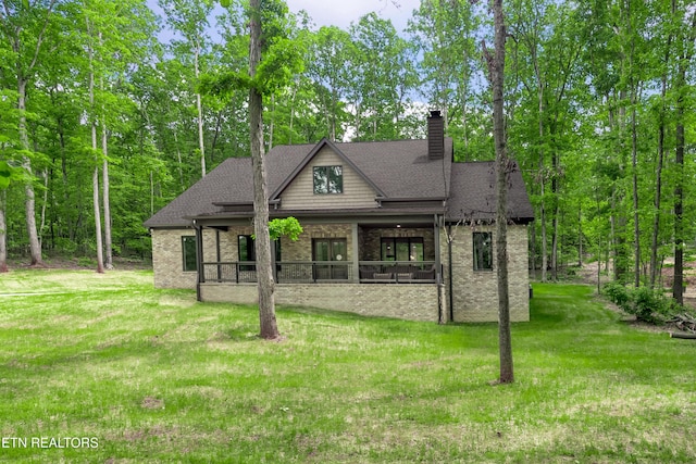 8304 Davis Ferry Rd, Loudon, TN 37774 - view of front of house with a chimney, a front yard, brick siding, and a shingled roof