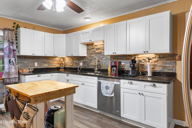 217 Jackson Dr, Harriman, TN 37748 - kitchen featuring stainless steel dishwasher, a sink, dark wood-style floors, ceiling fan, and backsplash