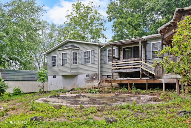 217 Jackson Dr, Harriman, TN 37748 - rear view of property featuring a wooden deck and crawl space