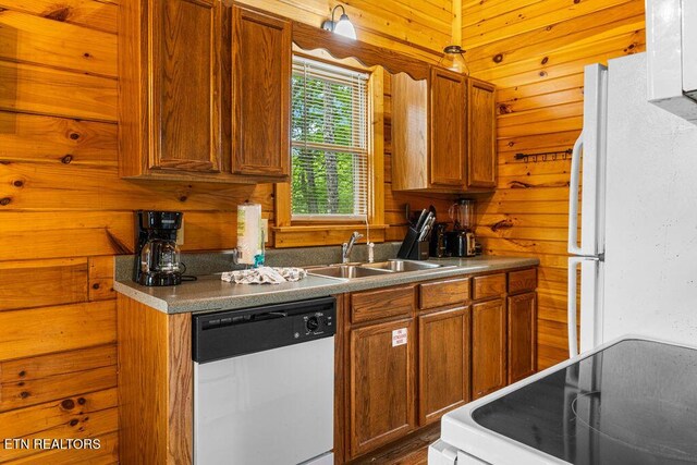 614 Hillybilly Haven Way, Gatlinburg, TN 37738 - kitchen with a sink, wood walls, white appliances, and brown cabinets