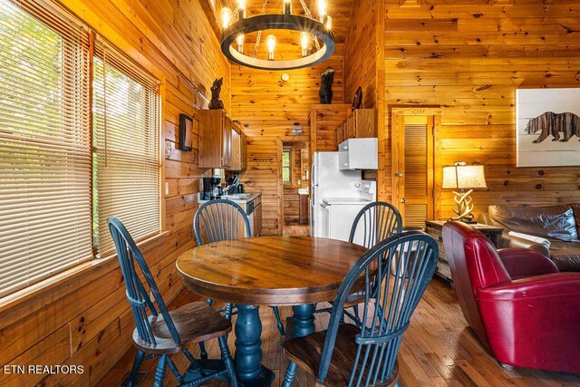 614 Hillybilly Haven Way, Gatlinburg, TN 37738 - dining room with hardwood / wood-style flooring, wooden walls, and a healthy amount of sunlight