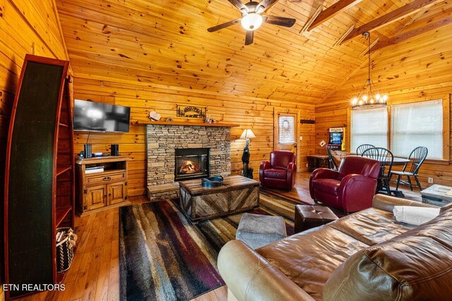 614 Hillybilly Haven Way, Gatlinburg, TN 37738 - living area featuring wooden ceiling, ceiling fan with notable chandelier, wood walls, hardwood / wood-style flooring, and a fireplace