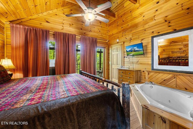 614 Hillybilly Haven Way, Gatlinburg, TN 37738 - bedroom featuring multiple windows, wooden ceiling, wood walls, and lofted ceiling