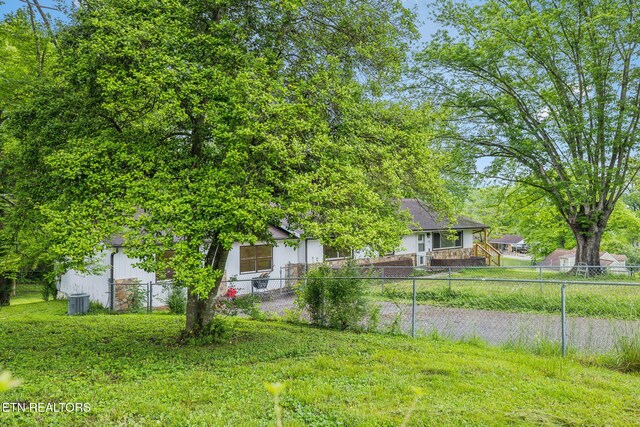 138 Lilac Dr, Lafollette, TN 37766 - fenced yard featuring central air condition unit