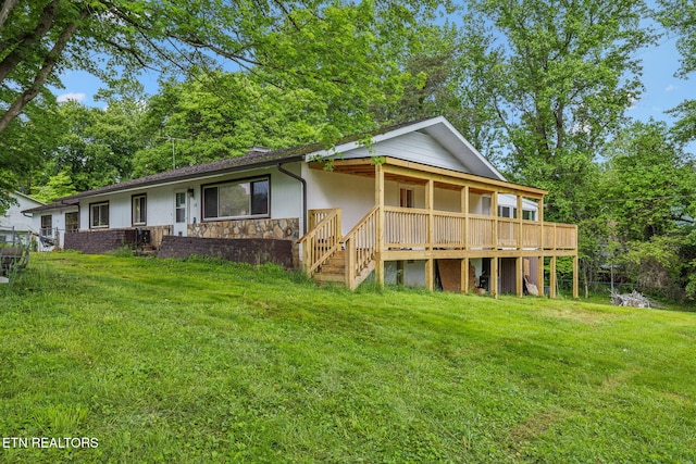 138 Lilac Dr, Lafollette, TN 37766 - view of front facade with stone siding, a front yard, and stucco siding