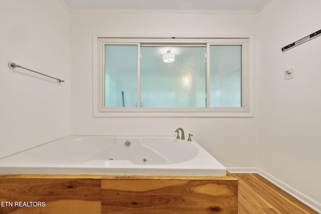 138 Lilac Dr, Lafollette, TN 37766 - full bathroom featuring wood finished floors, a tub with jets, crown molding, and baseboards