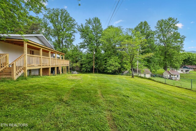 138 Lilac Dr, Lafollette, TN 37766 - view of yard featuring a deck and view of scattered trees