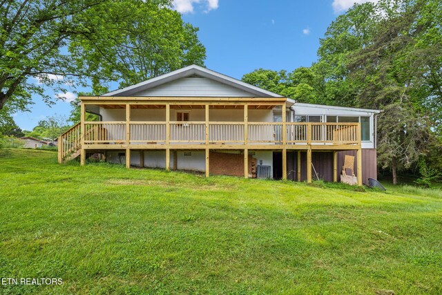 138 Lilac Dr, Lafollette, TN 37766 - rear view of property with a yard and a wooden deck