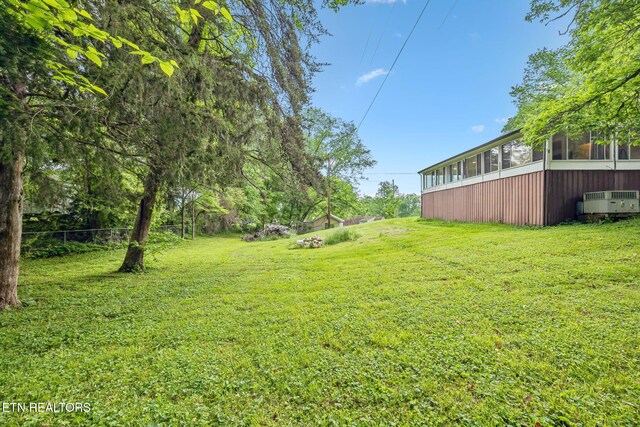 138 Lilac Dr, Lafollette, TN 37766 - view of grassy yard with a sunroom