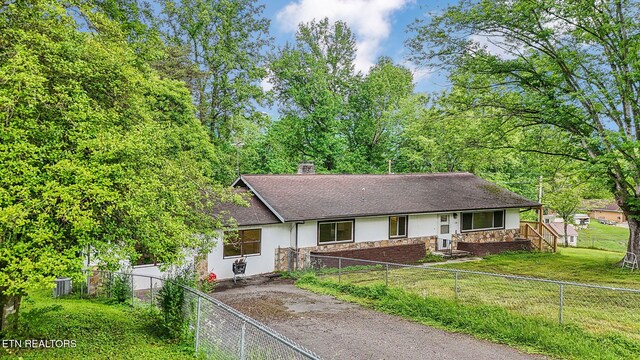 138 Lilac Dr, Lafollette, TN 37766 - ranch-style house featuring stone siding, stucco siding, a chimney, and a shingled roof