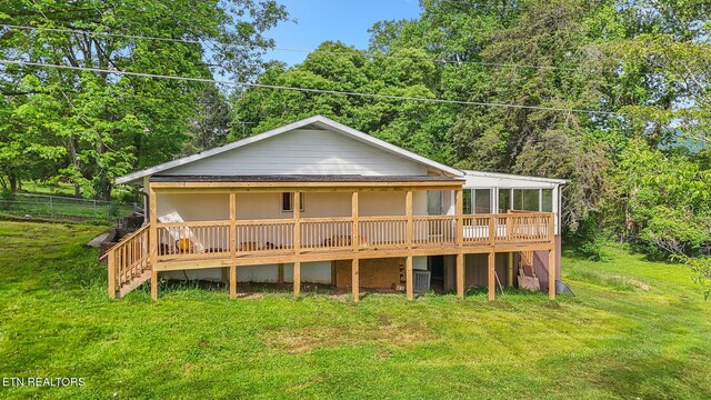 138 Lilac Dr, Lafollette, TN 37766 - rear view of property with central AC, a lawn, and a deck