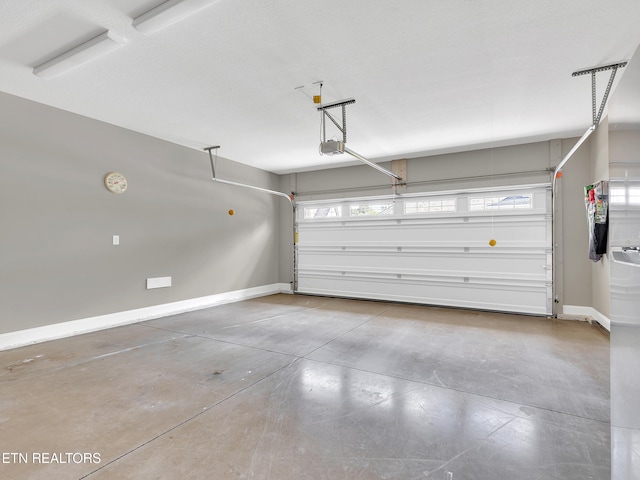 11842 Gecko Dr, Knoxville, TN 37932 - garage with a garage door opener and baseboards