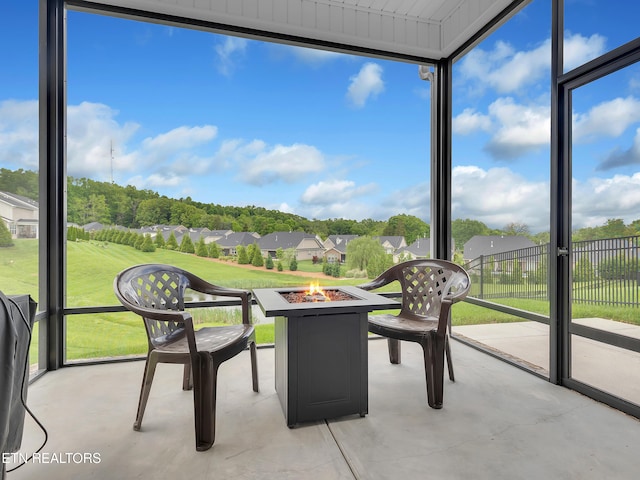 11842 Gecko Dr, Knoxville, TN 37932 - unfurnished sunroom featuring a fire pit and a residential view