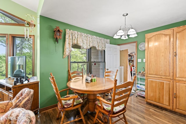 dining area featuring a chandelier and light wood-style flooring