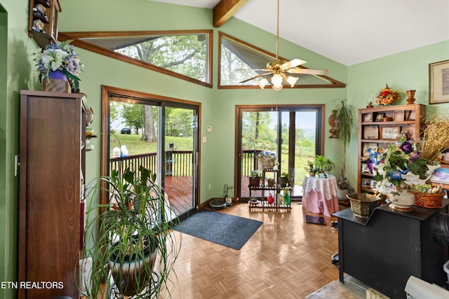 entryway with a ceiling fan, plenty of natural light, and baseboards