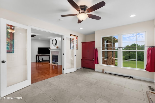 687 Burchfield Rd, Dandridge, TN 37725 - unfurnished living room with a ceiling fan, light tile patterned flooring, recessed lighting, baseboards, and a fireplace with flush hearth