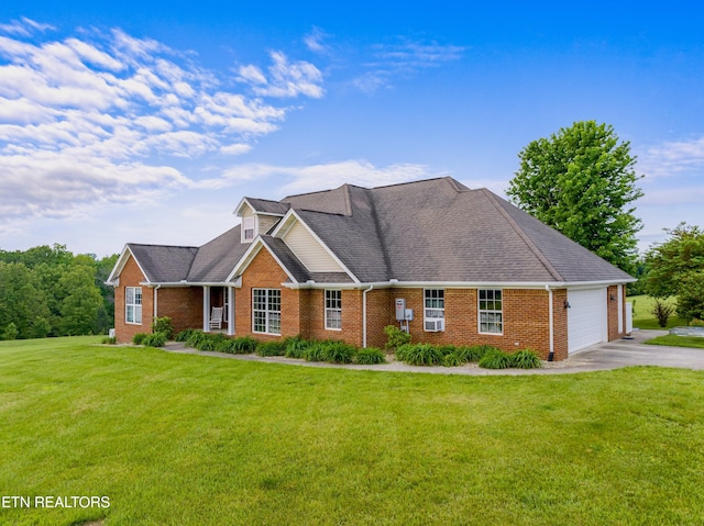 687 Burchfield Rd, Dandridge, TN 37725 - view of front of home featuring asphalt driveway, an attached garage, brick siding, and a front lawn