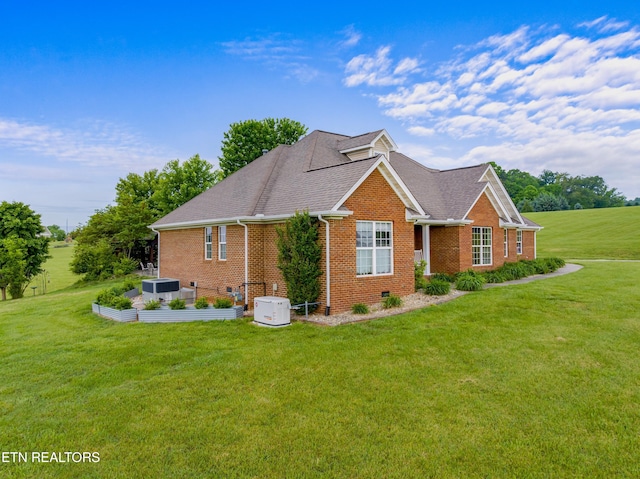 687 Burchfield Rd, Dandridge, TN 37725 - view of side of home featuring brick siding, a yard, a shingled roof, and central air condition unit