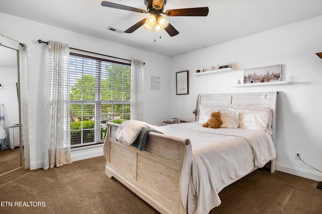 bedroom featuring carpet, multiple windows, baseboards, and a ceiling fan