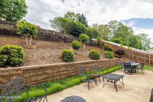 view of patio / terrace featuring outdoor dining space and a fenced backyard