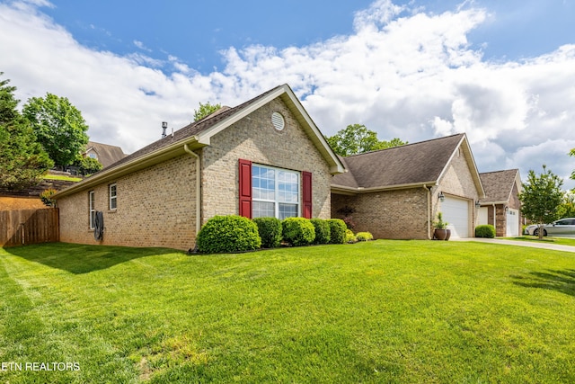 view of side of home with a garage, brick siding, driveway, and roof with shingles