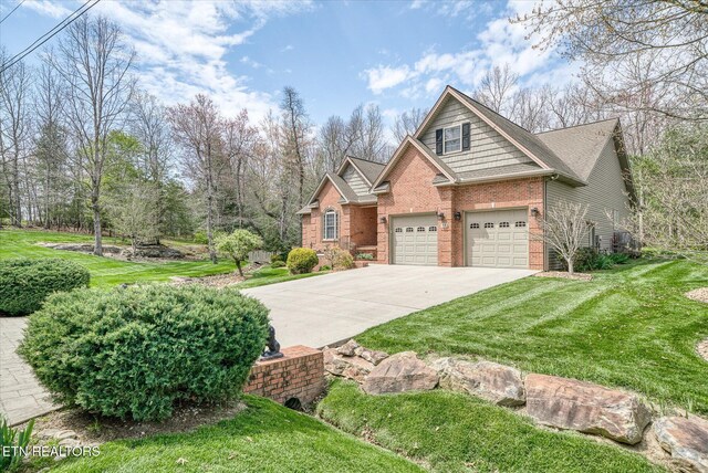13 Holly Ct, Crossville, TN 38558 - craftsman-style house featuring brick siding, concrete driveway, a front yard, and an attached garage