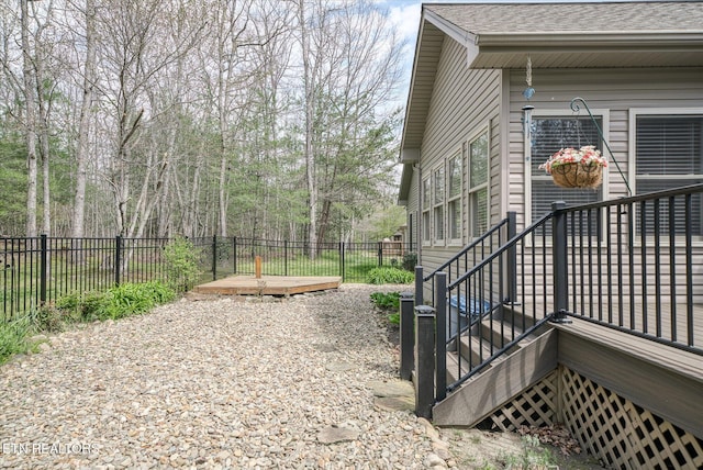 13 Holly Ct, Crossville, TN 38558 - view of property exterior with a fenced backyard, a shingled roof, and a wooden deck