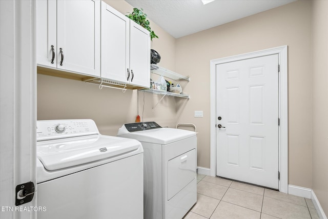 13 Holly Ct, Crossville, TN 38558 - laundry room with independent washer and dryer, cabinet space, baseboards, and light tile patterned floors