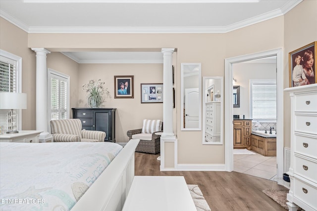 13 Holly Ct, Crossville, TN 38558 - bedroom with decorative columns, multiple windows, light wood-style flooring, ornamental molding, and connected bathroom