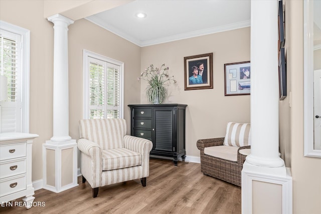 13 Holly Ct, Crossville, TN 38558 - sitting room featuring decorative columns, light wood finished floors, crown molding, baseboards, and recessed lighting
