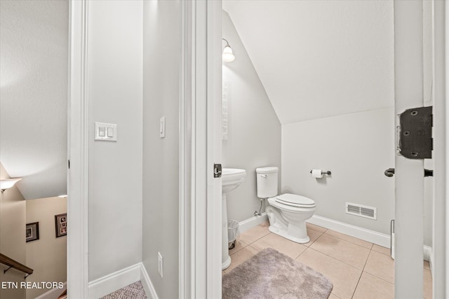 13 Holly Ct, Crossville, TN 38558 - half bathroom with toilet, lofted ceiling, tile patterned floors, and baseboards