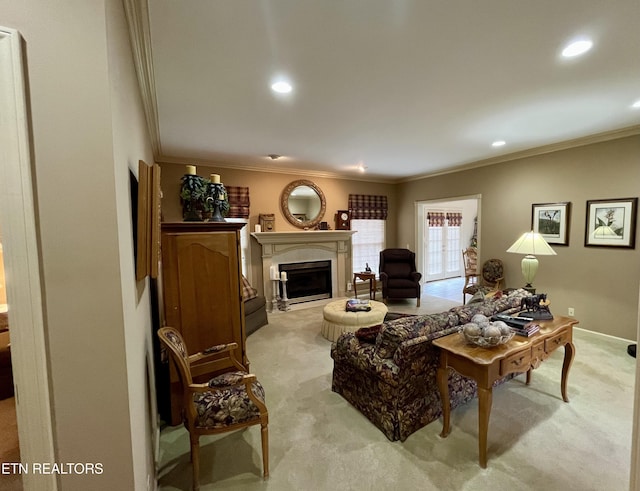 living area featuring light carpet, ornamental molding, a fireplace, recessed lighting, and baseboards