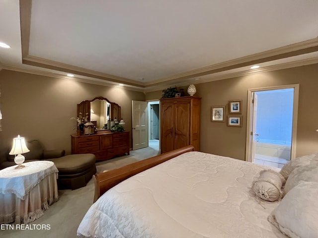 bedroom with light colored carpet, crown molding, recessed lighting, and connected bathroom