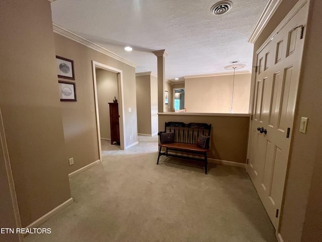 corridor featuring ornamental molding, baseboards, and light colored carpet