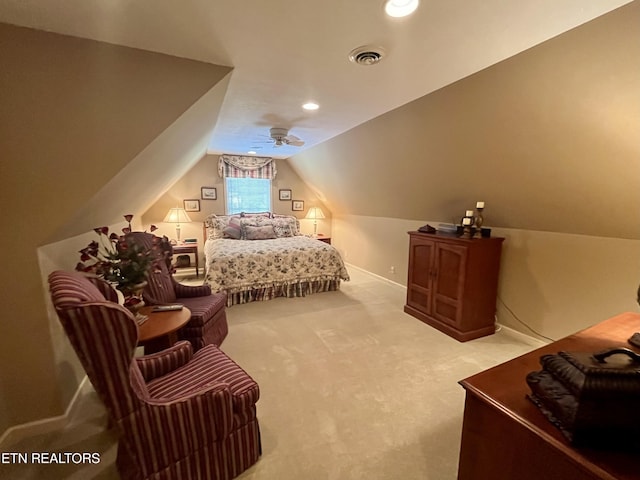 bedroom featuring lofted ceiling, light carpet, and baseboards