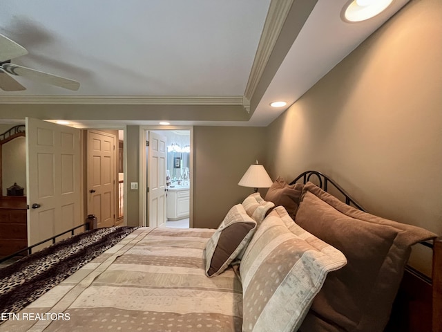 bedroom with ornamental molding, connected bathroom, and ceiling fan