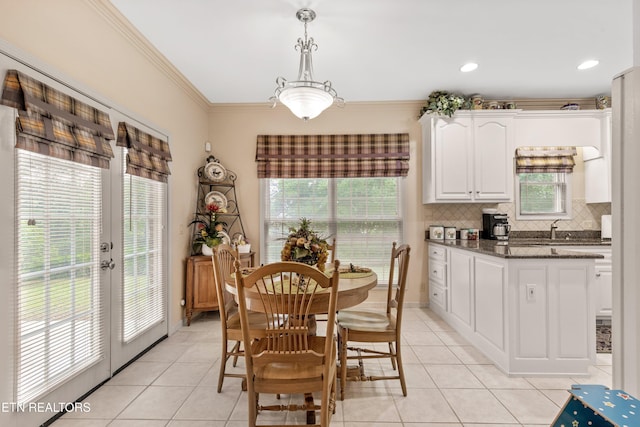 704 Blue Dun Ct, Pigeon Forge, TN 37863 - dining room with healthy amount of natural light, light tile patterned flooring, crown molding, and french doors