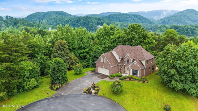 704 Blue Dun Ct, Pigeon Forge, TN 37863 - view of subject property featuring a mountain backdrop and a heavily wooded area