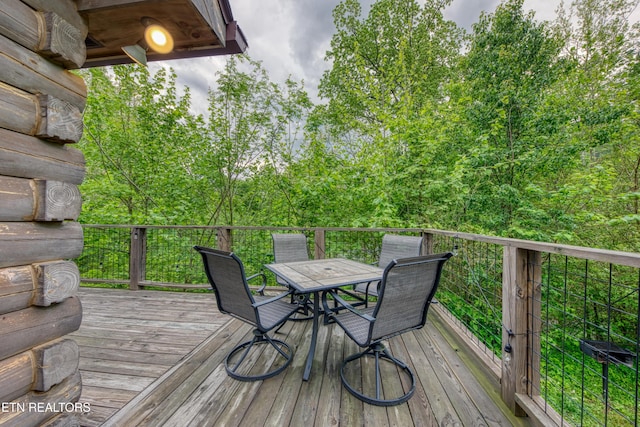 deck with outdoor dining area