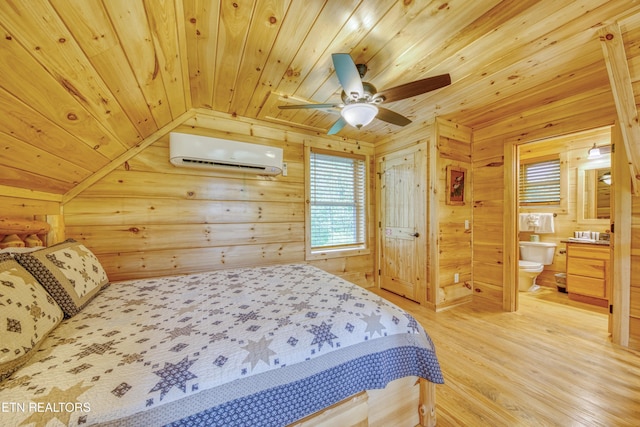 bedroom with a wall unit AC, wooden ceiling, light wood finished floors, wood walls, and vaulted ceiling