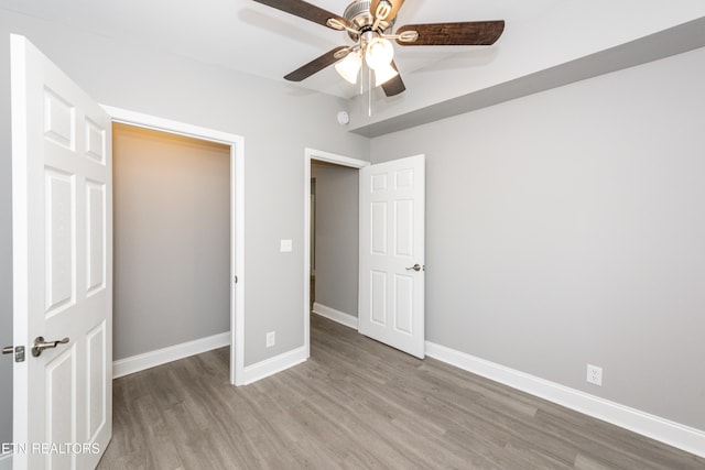 2208 Sanderson Rd, Knoxville, TN 37921 - unfurnished bedroom featuring wood finished floors, baseboards, and ceiling fan