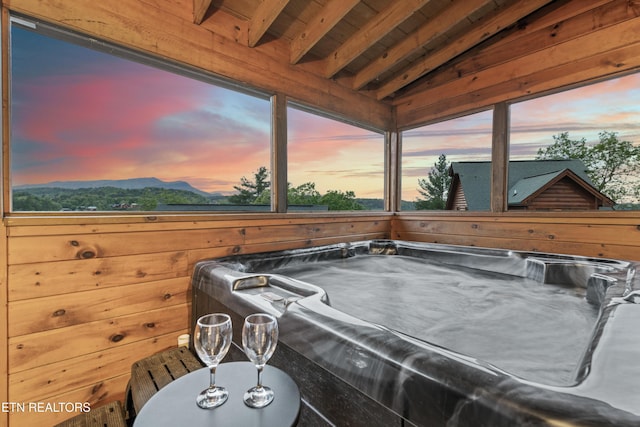 exterior view of a jacuzzi and a mountain view