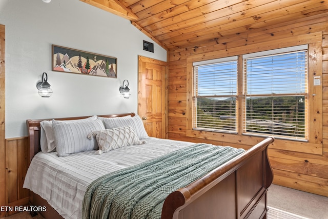 carpeted bedroom with lofted ceiling, wood walls, and wood ceiling